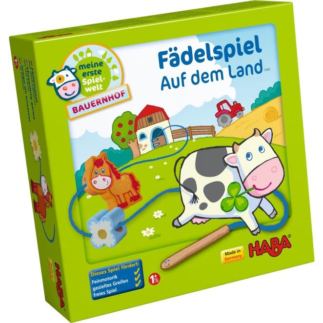 Vorderseite der Verpackung des Fädelspiels ‚Auf dem Land‘ mit liebevoll gestalteten Illustrationen von Bauernhoftieren und Fädelzubehör.